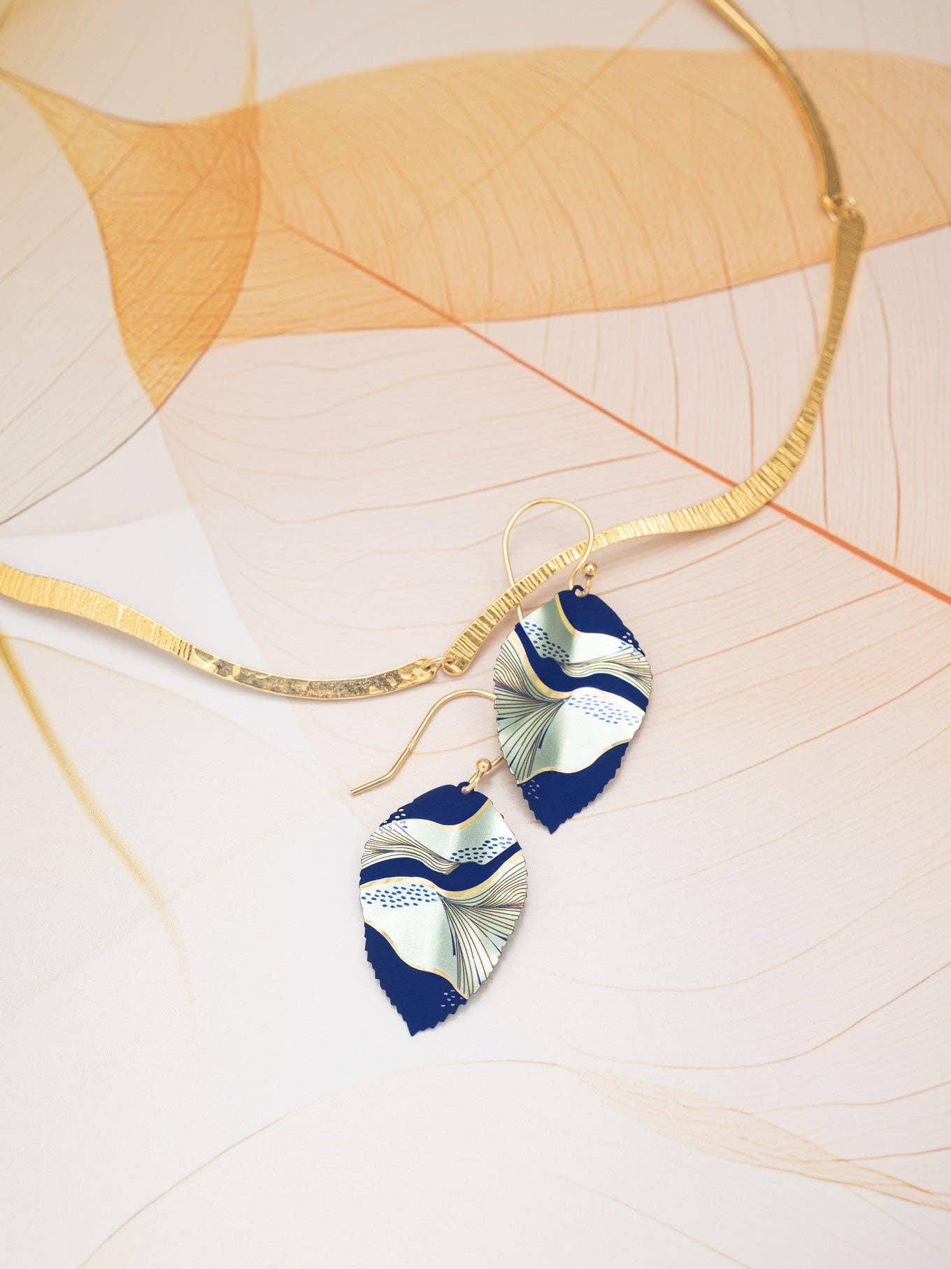 Eccentric Elm Earrings in a chic display, proving that you can wear nature’s beauty without getting your hands dirty—fashionably eco-friendly!