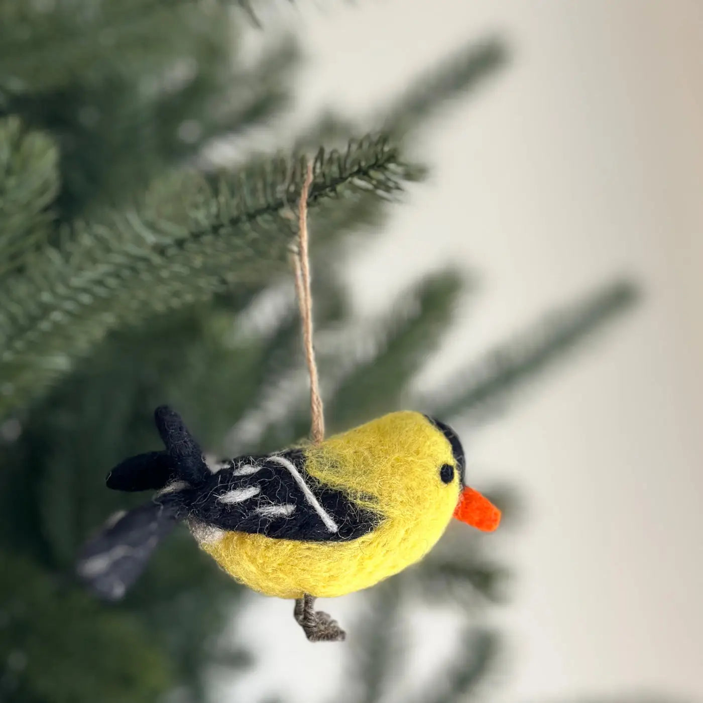 Charming Felt Bird Ornaments hanging on a Christmas tree, spreading holiday cheer.