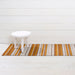Close-up of the Horizon Stripe Shag Mat | Desert, featuring looped TerraStrand yarns that are resistant to mold and mildew.