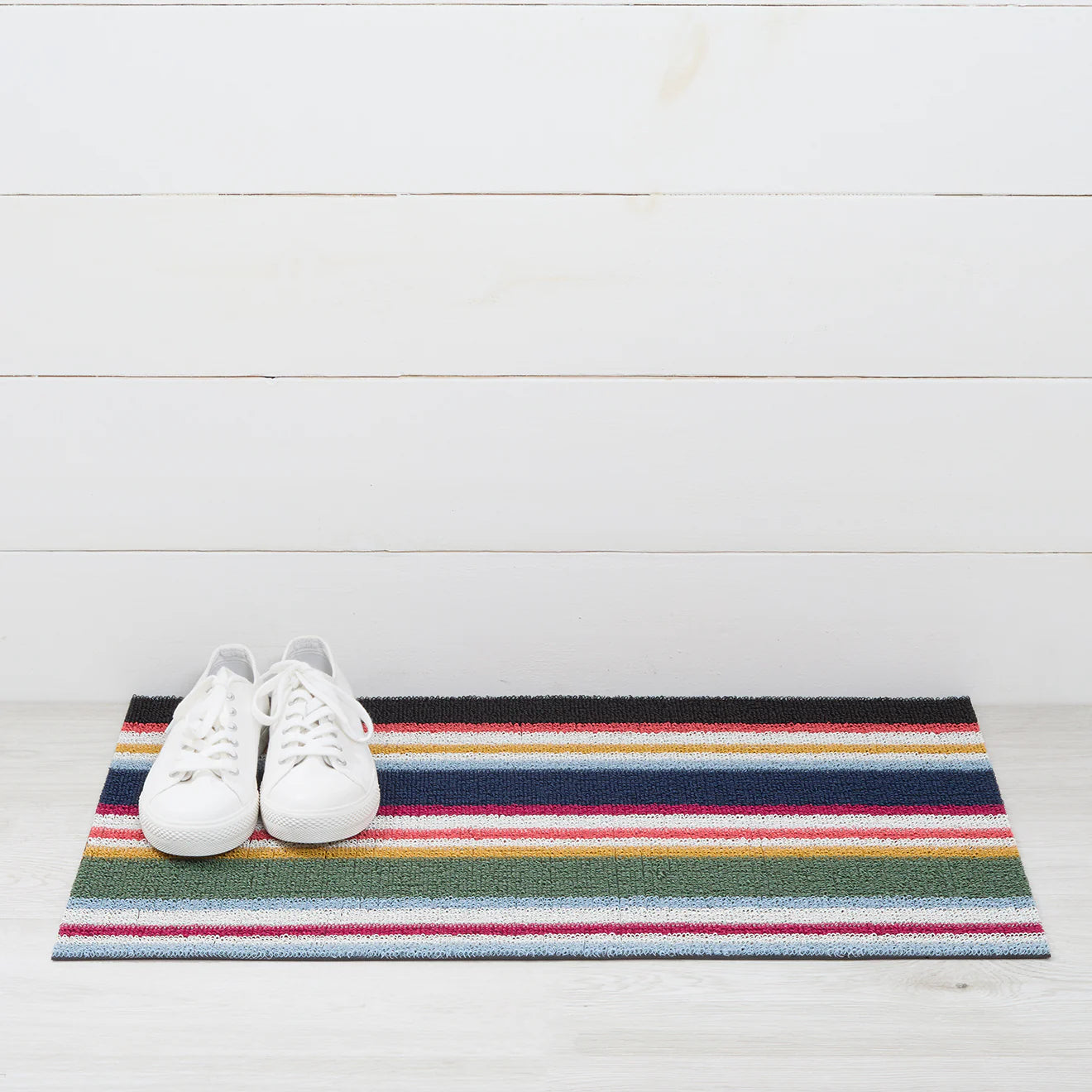 Shuffle Stripe Shag Mat by Chilewich in dynamic dark and light colors, perfect for doorsteps and entryways.