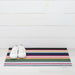 Shuffle Stripe Shag Mat by Chilewich in dynamic dark and light colors, perfect for doorsteps and entryways.