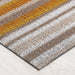 Horizon Stripe Shag Mat displayed in a stylish entryway, ideal for indoor and outdoor use.