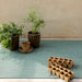 Basketweave Woven Floor Mat displayed in a modern living space, perfect for indoor and outdoor use.