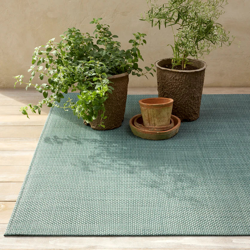Close-up view of the Basketweave Woven Floor Mat in Celadon, highlighting its woven texture and eco-friendly, low-maintenance features.