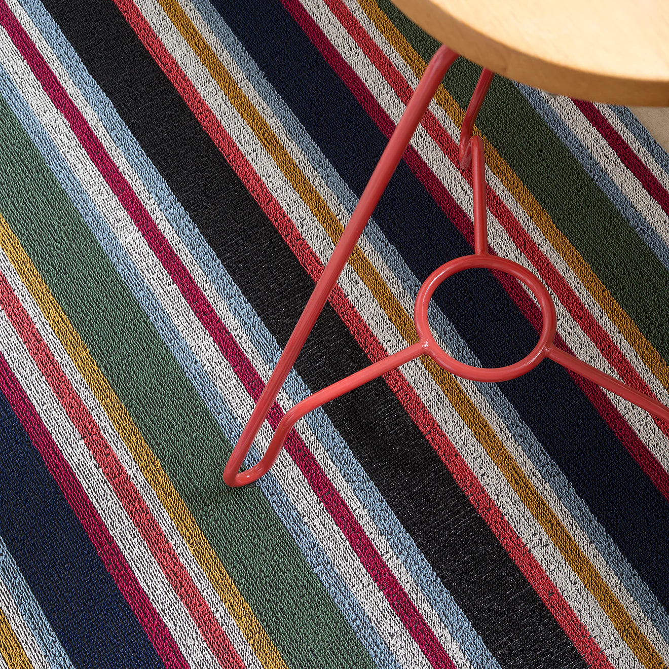 Outdoor setting with the Shuffle Stripe Shag Mat, highlighting its slip-resistant and easy-to-clean features.