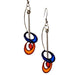Stylish Orbiting Circle Drop and Dot Earrings designed by Christopher Royal, featuring a playful blend of stainless steel and translucent resin, embodying urban sophistication and artistic flair.