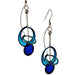 Blue Circle Orbit Dot Drop Earrings by Christopher Royal, featuring a blend of stainless steel and translucent resin, inspired by kinetic sculptures.