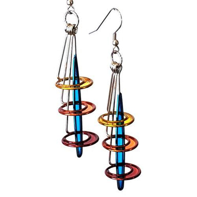 Triple Stacked Orbit Slice Earrings designed by Christopher Royal, featuring a unique combination of stainless steel and translucent resin, showcasing a blend of urban sophistication and playful elegance.