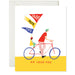 Whimsical Father's Day card from ARTISANS & agency depicting a father and child riding a bicycle, with colorful flags that say 'Dada', 'Papa', and 'Pops', included in the Father's Day Card Collection.