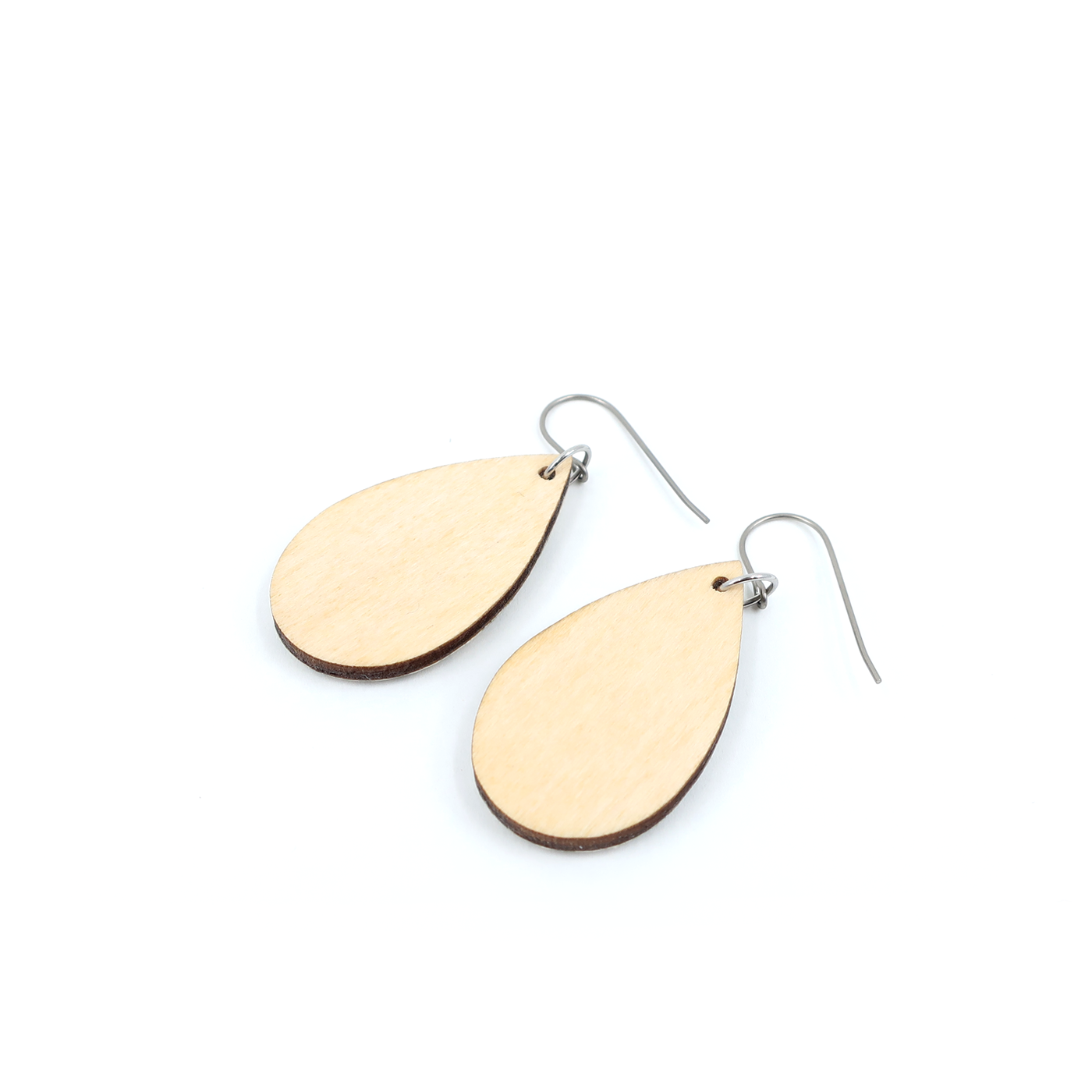 Product shot of Teardrop burst Chiyogami titanium earrings - Red on a natural background, emphasizing craftsmanship and resin finish.