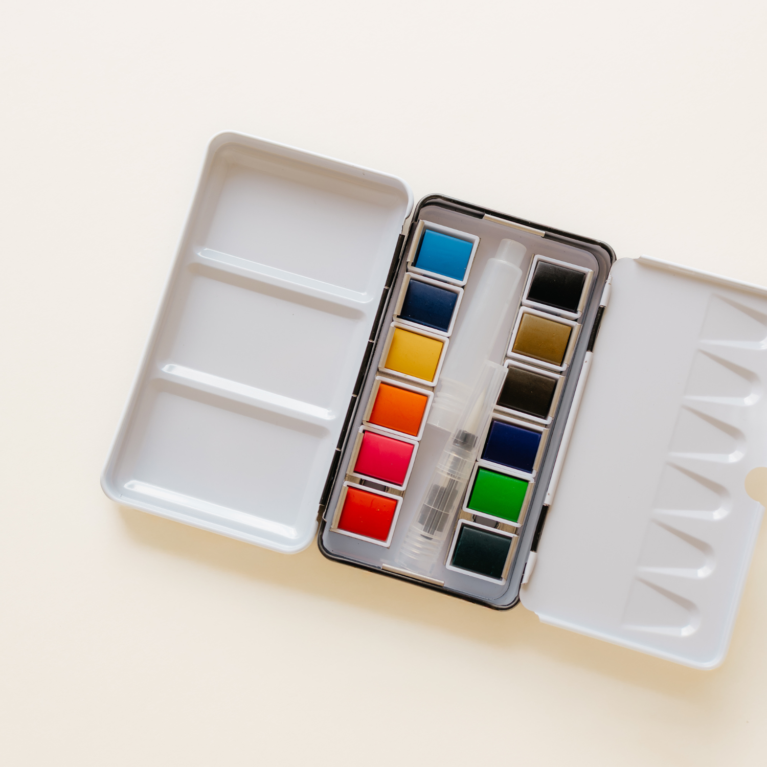 12 Color Mini-Travel Watercolor Paint Palette with a built-in mixing area for effortless color blending.