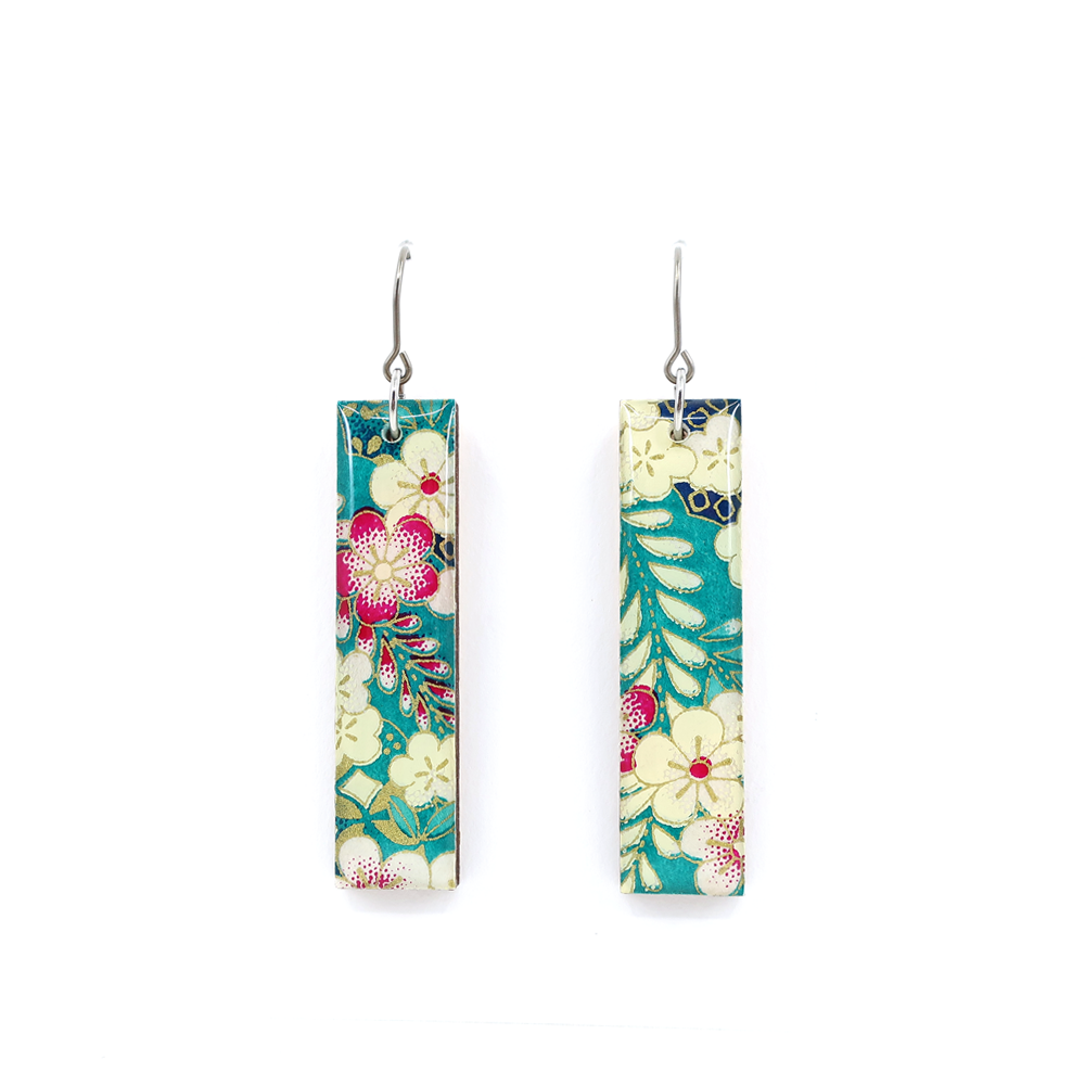 Close-up of teal floral Chiyogami long bar earrings with titanium hooks showing intricate paper design