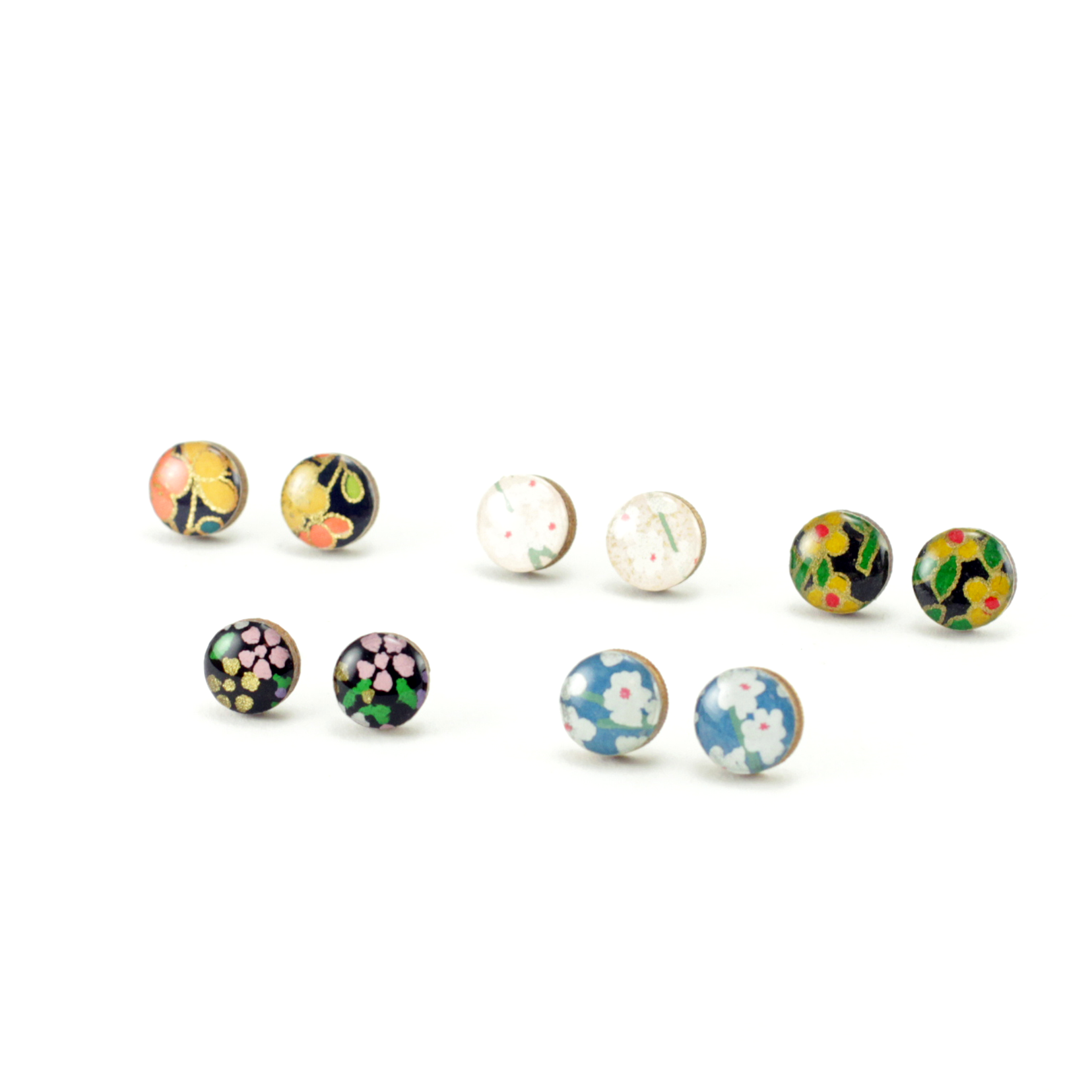 Stylish patterned mini titanium stud earrings displayed with mixed Japanese Chiyogami and marbled paper elements.