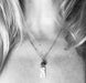 Alternate view of Flower Power Necklace by Suzanna Garrett Designs — a dainty wildflower pendant gets a little extra texture from dark river stone pebbles