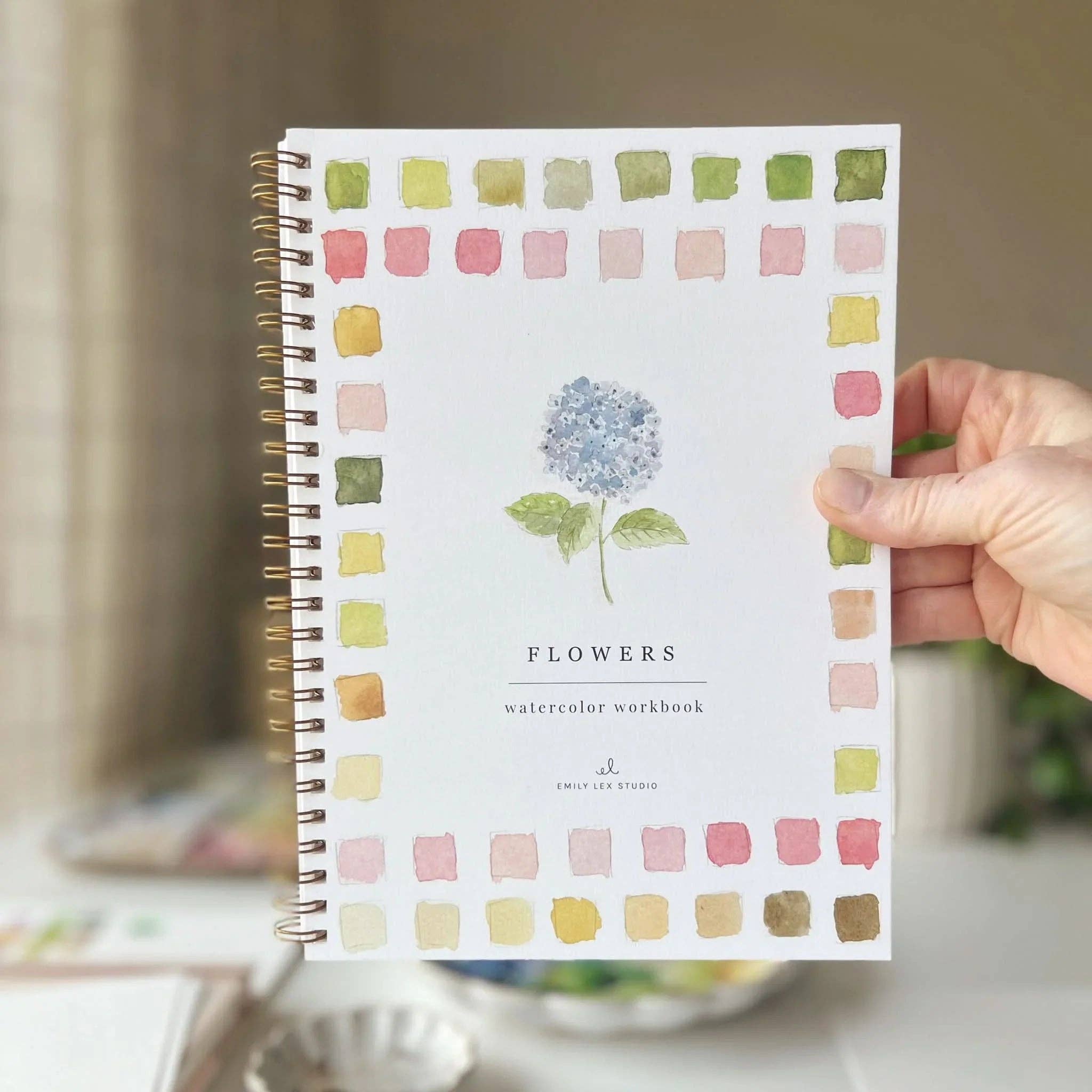 Inside pages of the Flowers Watercolor Workbook showing simple outlined sketches ideal for kids and adults.