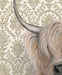 Framed art print of a Highland cow on an ornate patterned background