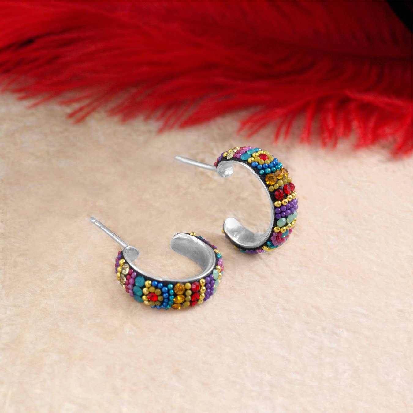 Close-up of the Petite Crystal & Silver Huggie Earrings featuring colorful crystals that add a playful touch, designed by Mosaico Jewels for a chic accessory.