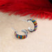 Close-up of the Petite Crystal & Silver Huggie Earrings featuring colorful crystals that add a playful touch, designed by Mosaico Jewels for a chic accessory.