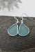 Eco Glass Bezel Drop Silver Earrings in Aqua showcasing their stunning frosted glass design and elegant sterling silver setting.