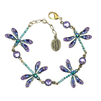 Purple and Iridescent Green Dragonfly Crystal Charm Bracelet by Anne Koplik Designs, featuring four hand-enameled dragonflies, adorned with iridescent crystals and shimmering Tanzanite crystal links, symbolizing transformation and good fortune.