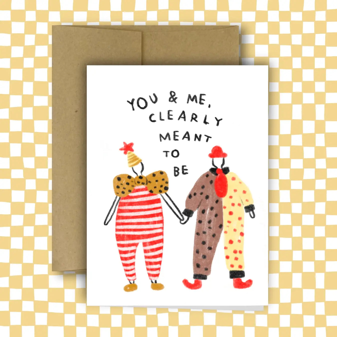 Greeting card with cartoon characters and text 'You & Me, Clearly Meant to Be' on a checkered background