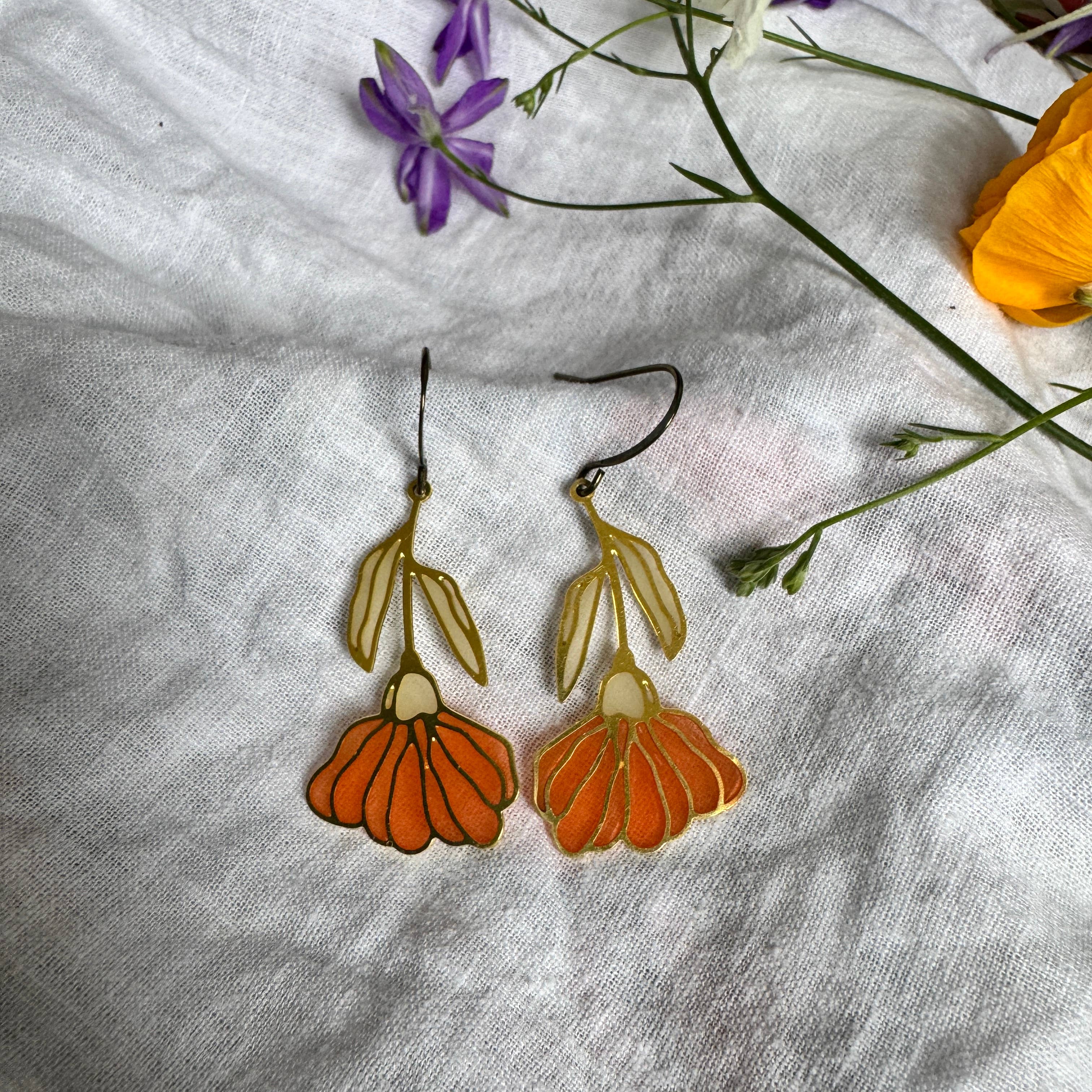 Begonia Stained Glass Resin Earrings showcasing a brass botanical design that dazzles like a rainbow in sunlight.