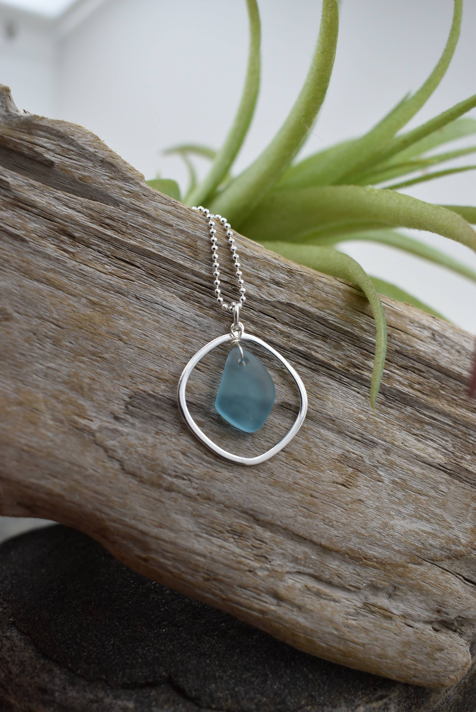 Silver pendant necklace with blue sea glass