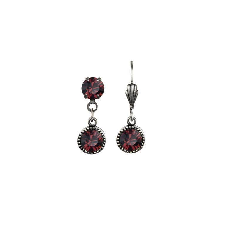 Pair of silver drop earrings with red gemstones