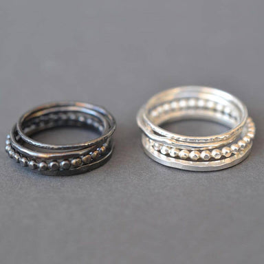 Charming Silver Stacking Rings - set of 4, perfect for when you can't pick just one! Featuring a square band and a dotted band, these rings are stylishly rustic.