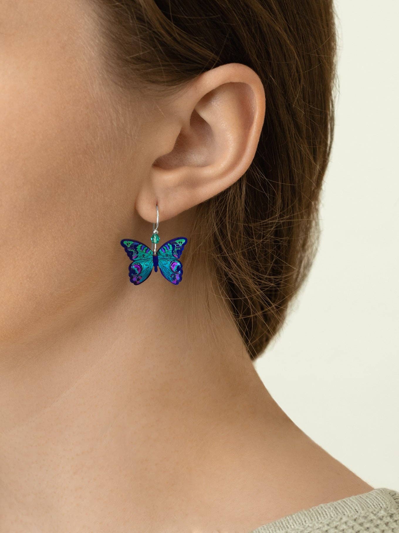Mariposa Butterfly Earrings in sterling silver, showcasing their enchanting flutter—perfect for adding a dash of whimsy to any outfit!