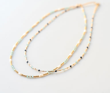 gold beaded and stone necklace