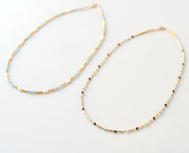 gold beaded and stone necklace