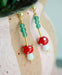 beaded drop earrings with painted mushroom