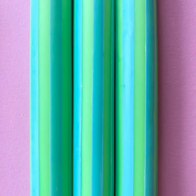 Colorful display of Pinstripe Individual Candles, perfect for mixing and matching, from The Colour Emporium.