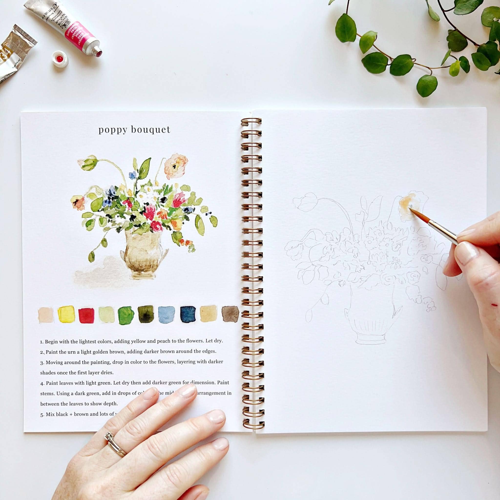 Relaxing painting session with the Bouquets watercolor workbook, perfect for all ages.