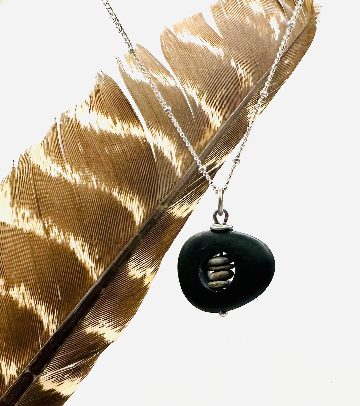 Silver Core Short Rock Stack Necklace by Suzanna Garrett Designs — a river stone with a tiny pebble stack tucked inside is exactly the kind of detail worth looking twice at