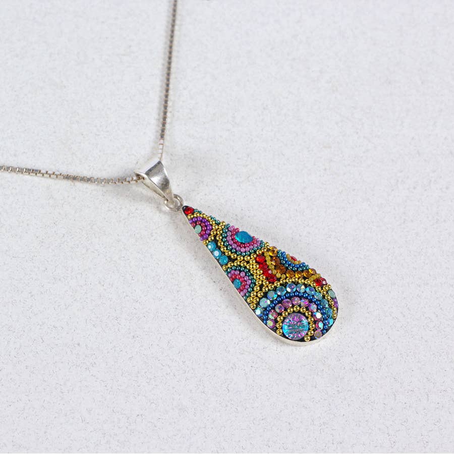 Stylish close-up of the Morning Drop Pendant, highlighting its minimalistic and meaningful beauty.