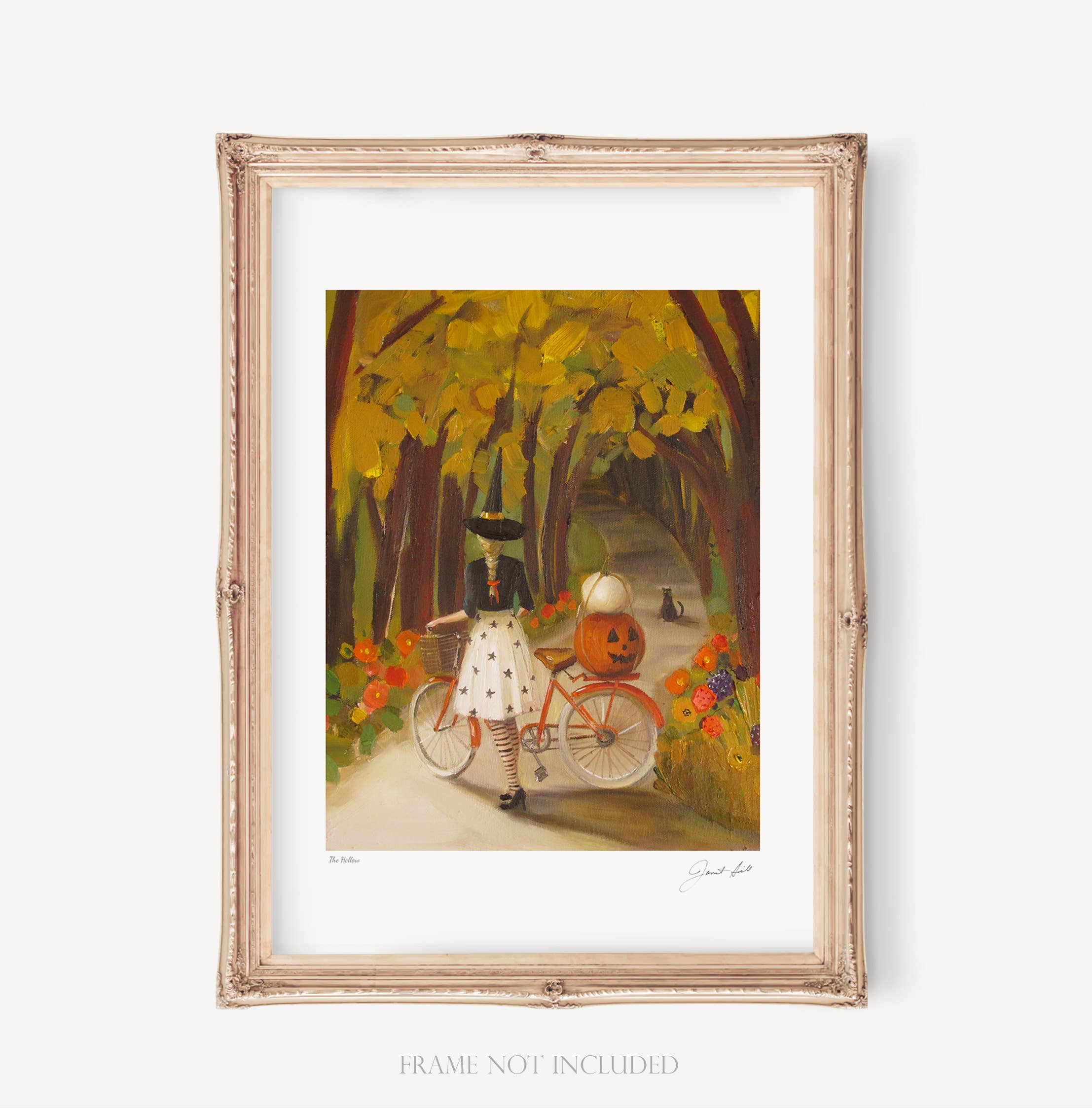 The Hollow Art Print by Janet Hill Studio depicting a whimsical scene of a girl riding a bicycle with a pumpkin and flowers along a tree-lined path, perfect for adding charm to any decor.