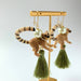 Lemur drop earrings with green tassel