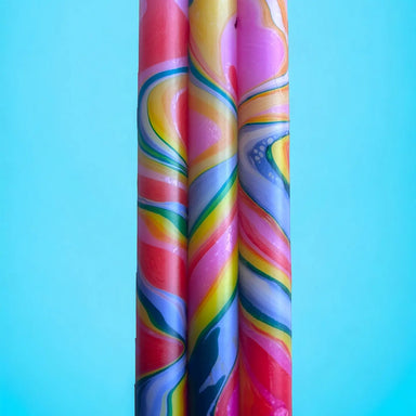 Vibrant marbled candle trios showcasing beautiful swirling patterns, ideal for adding a splash of color to any room.