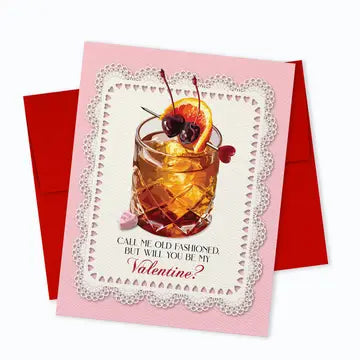 Valentine's Day card with a cocktail glass adorned with cherries and an orange slice, featuring the text 'Call me old fashioned but will you be my Valentine?'. Part of the Valentine's Day Card Collection by ARTISANS & agency.