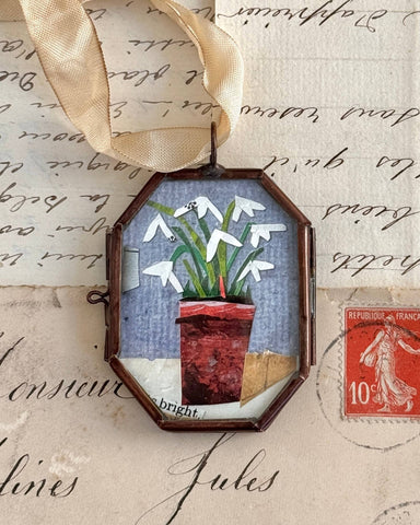 Vintage-style flower pot art locket ornament.