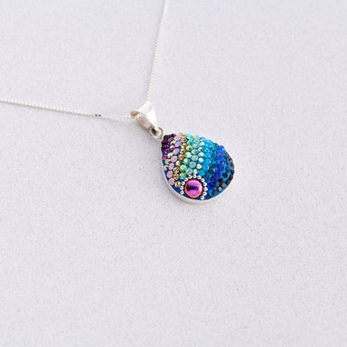 Dew Drop Pendant by Mosaico Jewels showcasing its delicate design and sparkling finish.