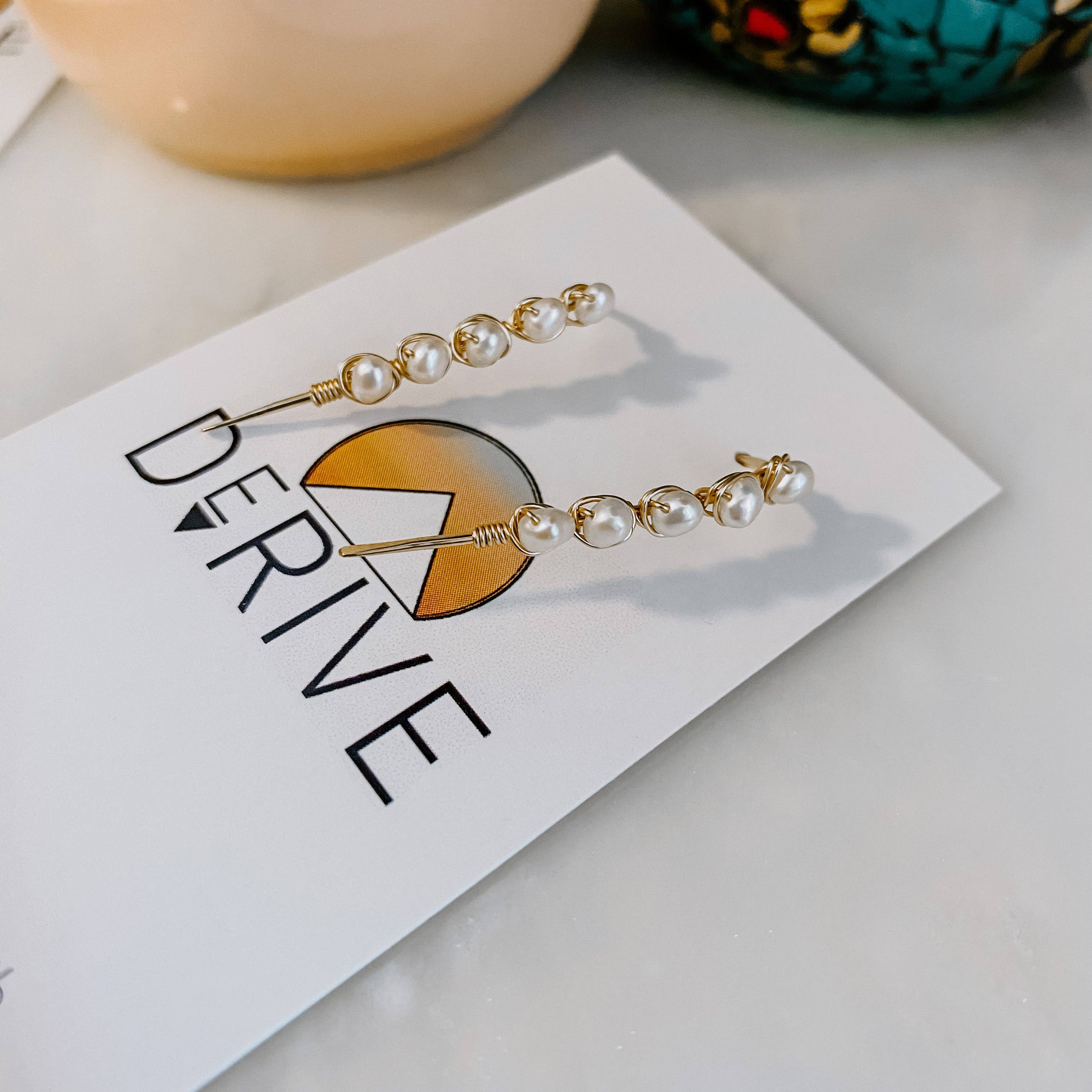Mini Pearl U Shaped Threader Earrings dangling like a playful swing set for your earlobes, ready for a fashion adventure!