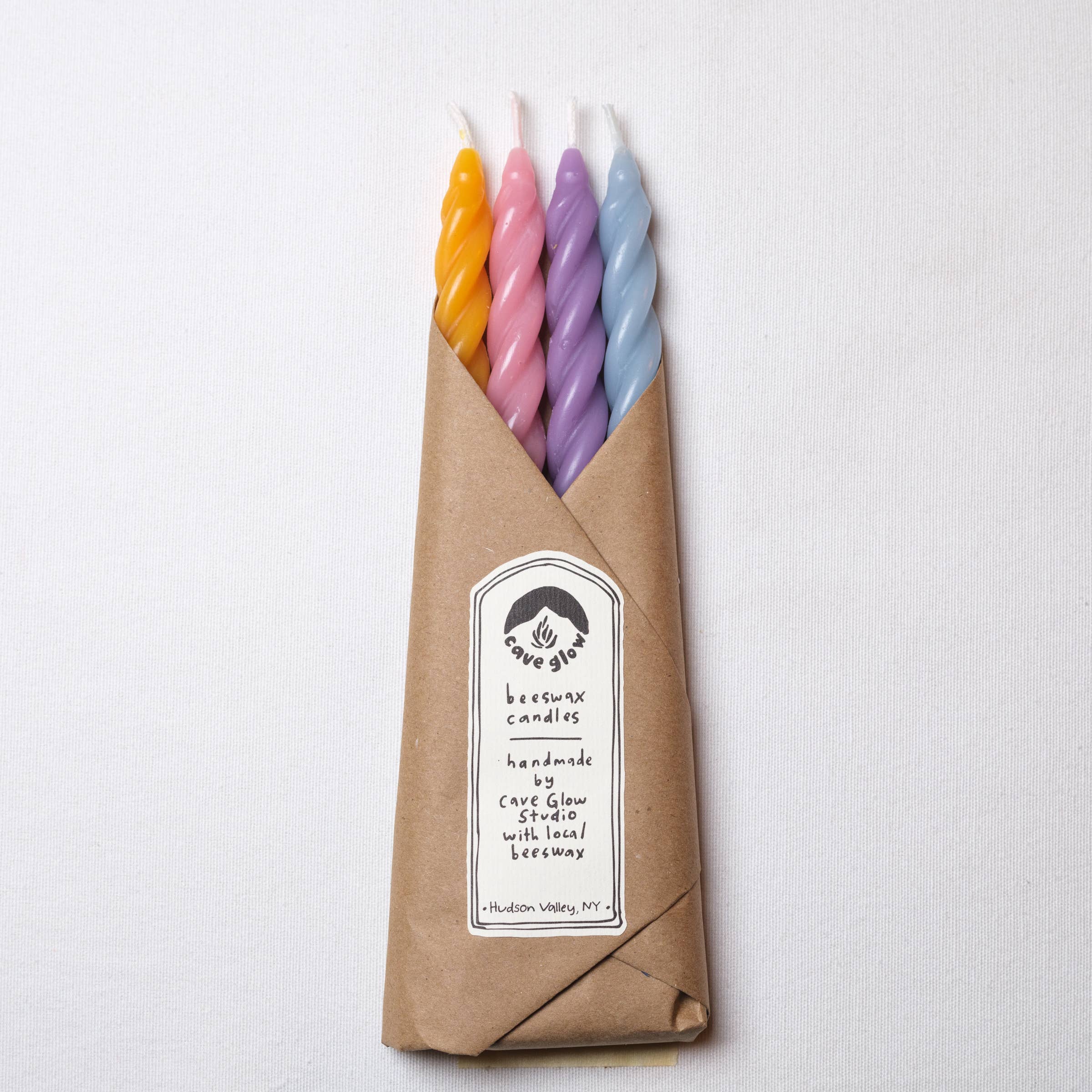 Wrapped Beeswax Spiral candles by Cave glow studio