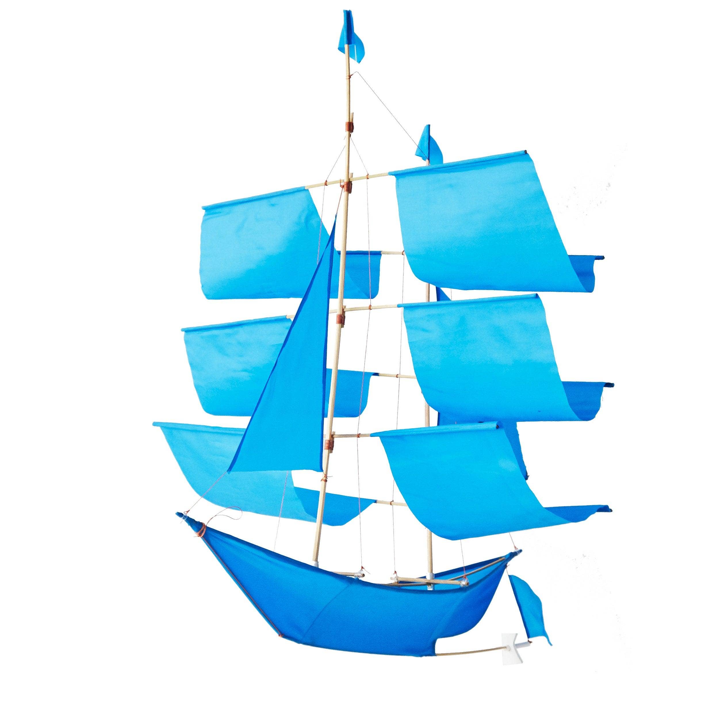 Vibrant blue Sailing Ship Kite by Haptic Lab, with colorful sails, designed for both flying and as a decorative piece.