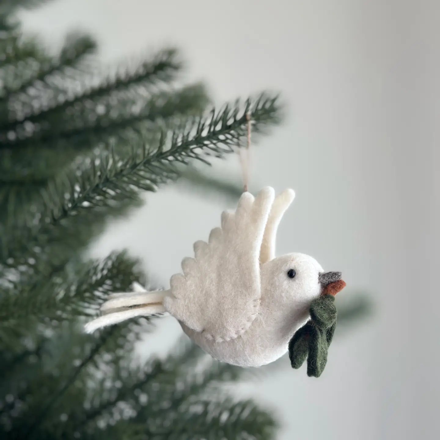Colorful Felt Bird Ornaments adding a joyful touch to Christmas celebrations.