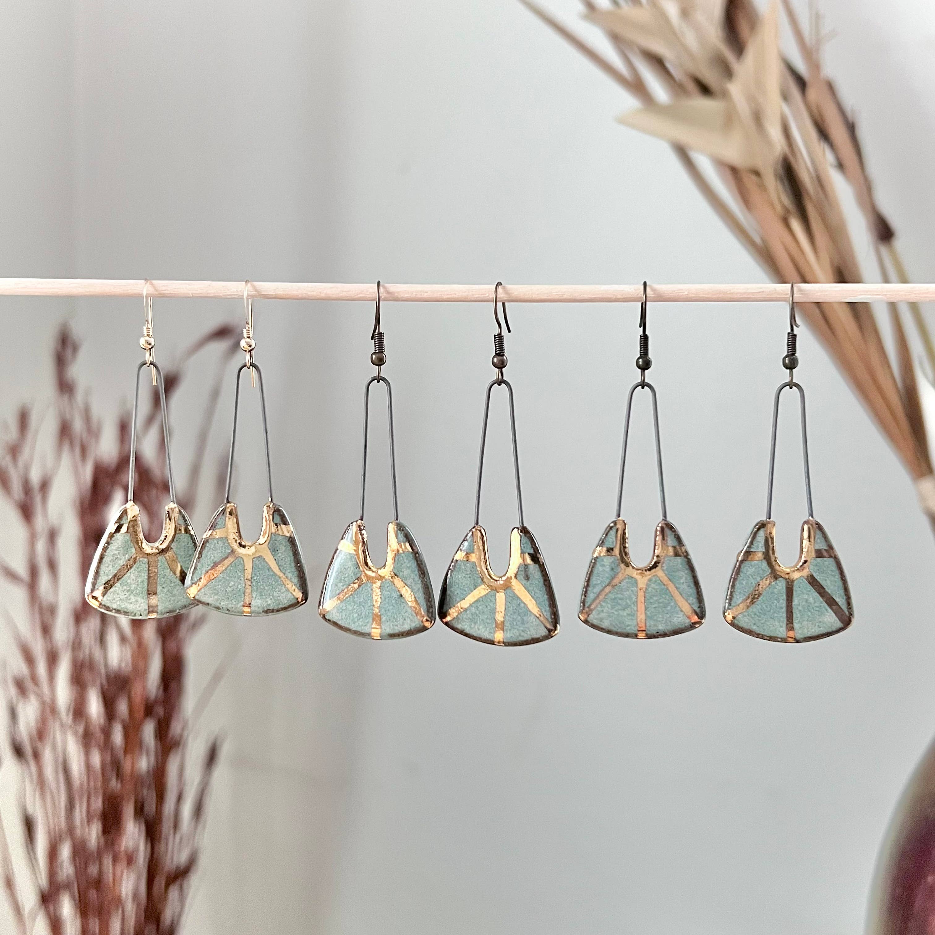 Turquoise Dropped Stoneware Earrings with Gold Sun Design