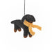 Felt Black and brown dog ornament with a yellow scarf