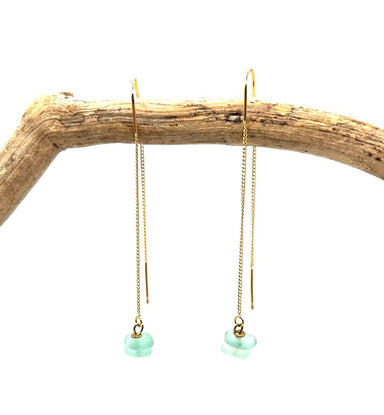 Sea Glass Golden Threaders by Suzanna Garrett Designs — icy blue sea glass pops against the warm finish of these long golden threaders